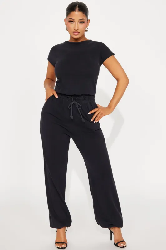 Heading Home Jumpsuit - Charcoal sold by Fashion Nova
