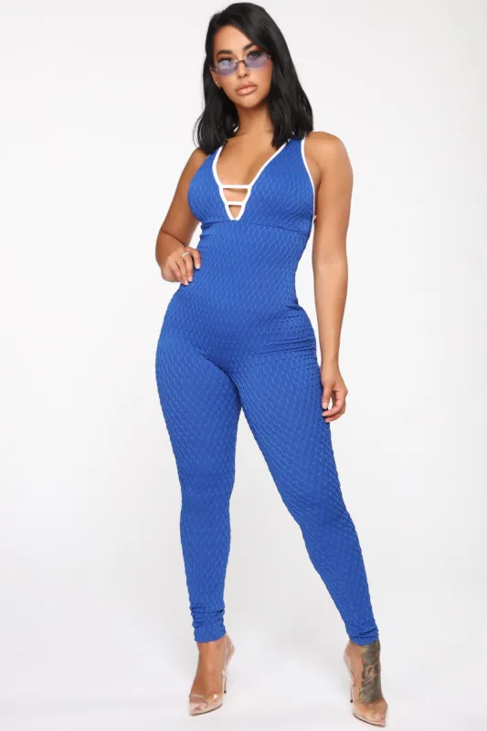 Feel The Rush Textured Jumpsuit - Royal/White sold by Fashion Nova