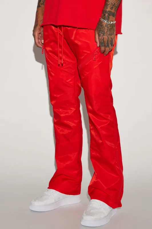 Play The Track Stacked Slim Flare Nylon Pants - Red sold by Fashion Nova