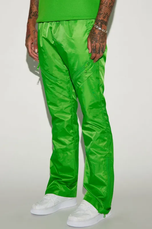 Play The Track Stacked Slim Flare Nylon Pants - Green sold by Fashion Nova