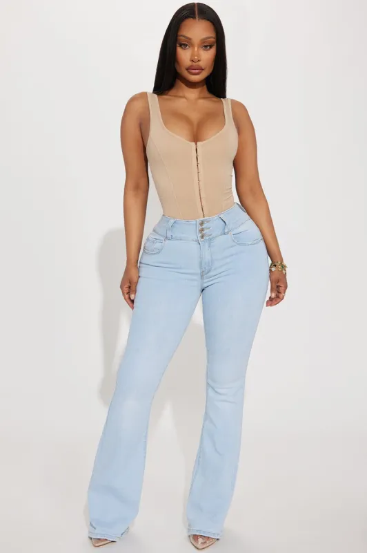Let It Slide Booty Lifting Stretch Bootcut Jeans - Light Wash sold by Fashion Nova