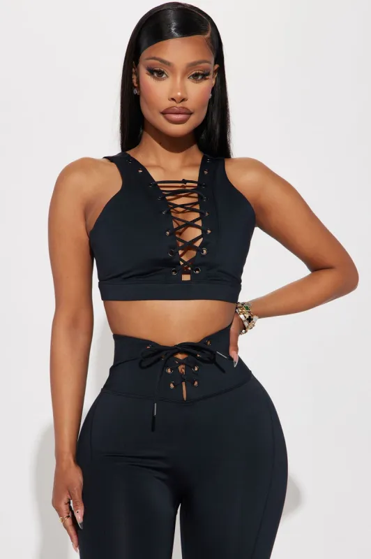 Hard Work Elevate Lace Up Sports Bra - Black sold by Fashion Nova