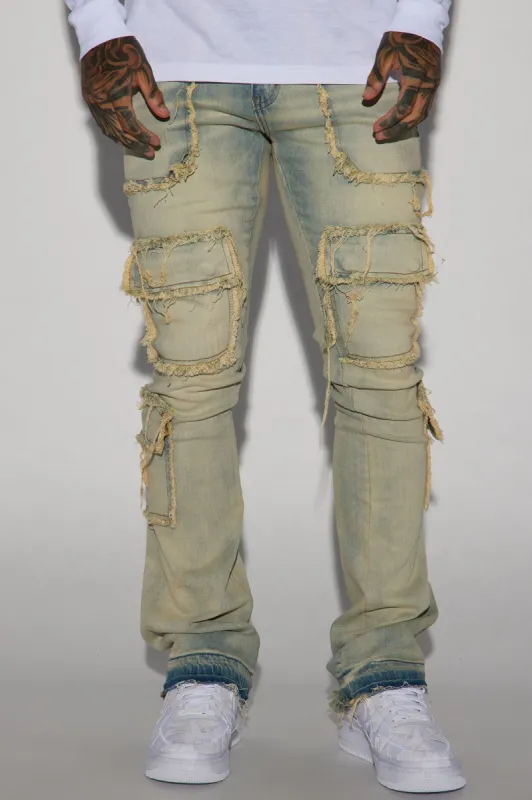 We In This Chained Stacked Skinny Flare Jeans - Light Wash sold by Fashion Nova
