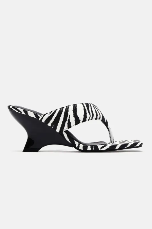 Let's Get Out Of Here Wedges - Black/White sold by Fashion Nova
