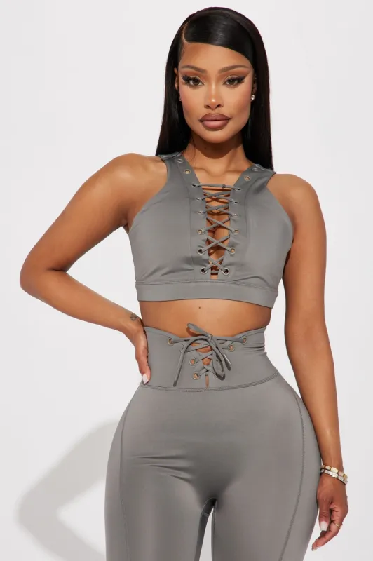 Hard Work Elevate Lace Up Sports Bra - Charcoal sold by Fashion Nova