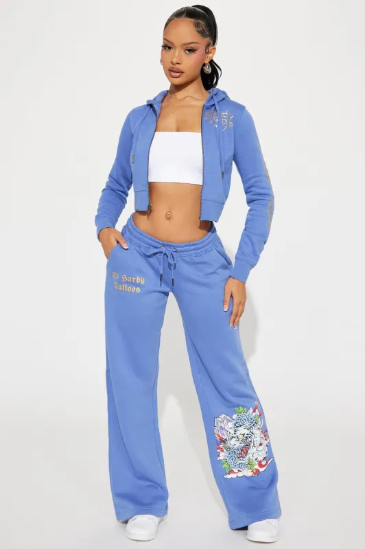 Ed Hardy Lotus Love Pant - Blue sold by Fashion Nova