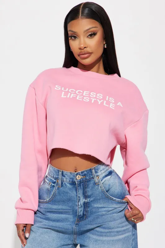 Success Is A Lifestyle Cropped Sweatshirt - Pink sold by Fashion Nova