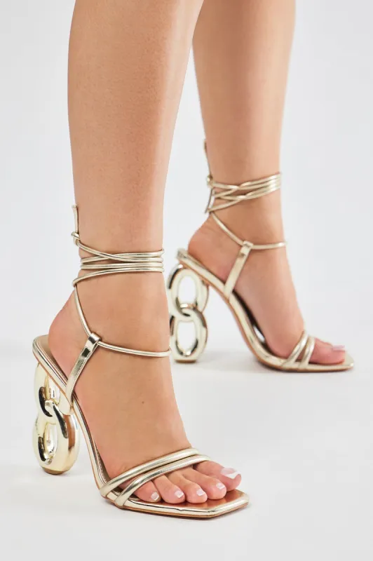 Super Babe Metallic Wrap Up Heeled Sandals - Gold sold by Fashion Nova