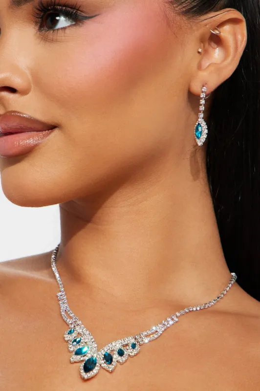 Rags To Riches Necklace And Earring Set - Silver/Blue sold by Fashion Nova