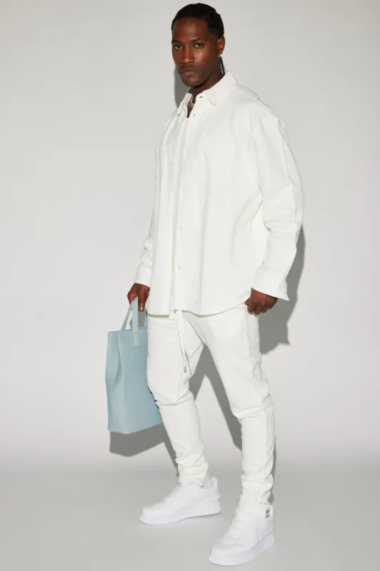 Dean Textured Slim Pants - White sold by Fashion Nova