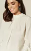 Ivory Blouse With Contrasting Tie Back Detail sold by Fever London