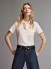 The Caddy Polo -- Cream sold by Frame Denim