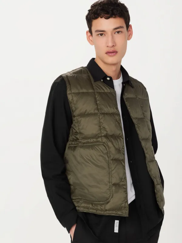 The Aero Packable Vest in Tuscany Green sold by Frank & Oak