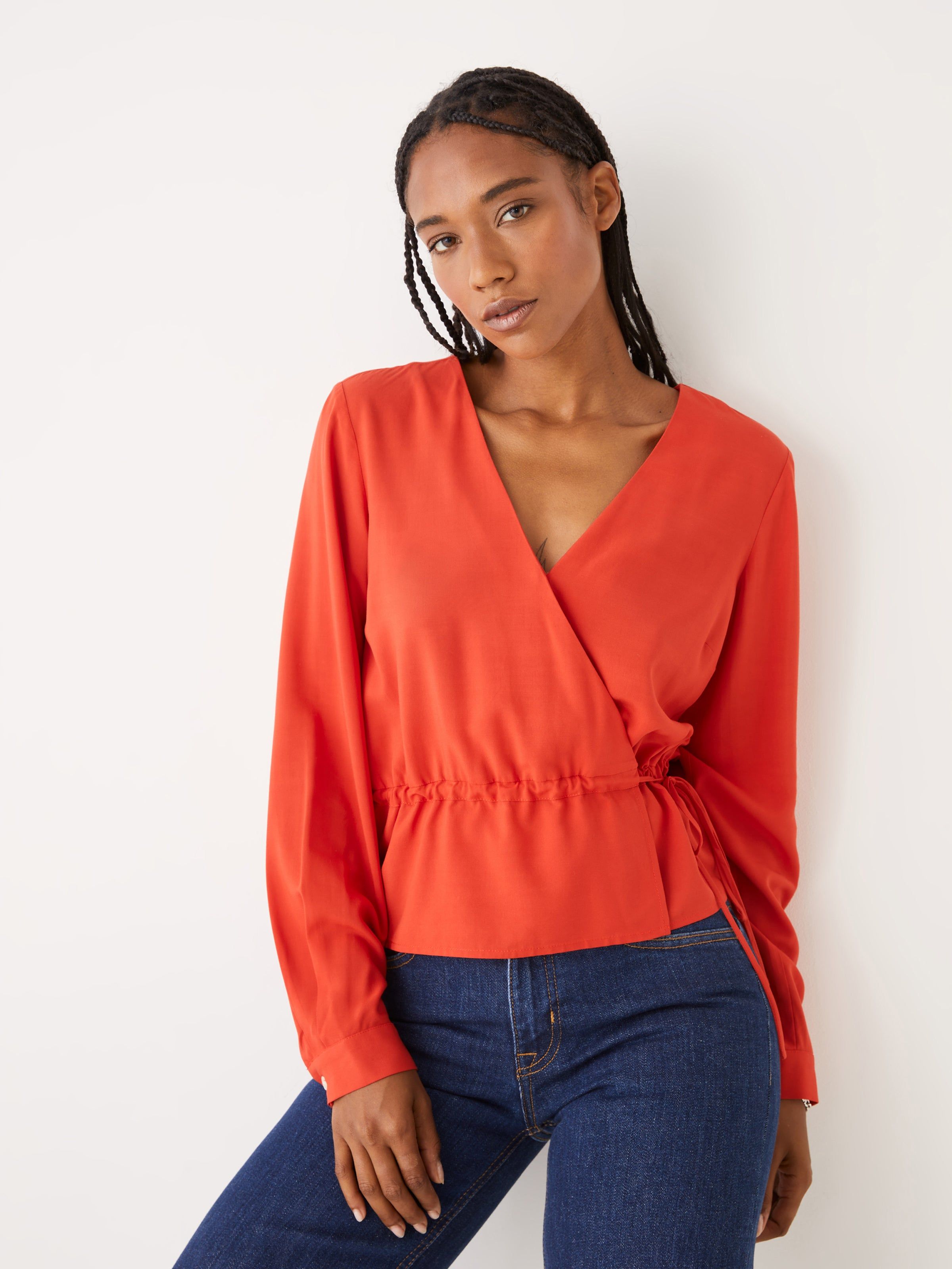 The Long Sleeve Wrap Top in Molten Lava sold by Frank & Oak