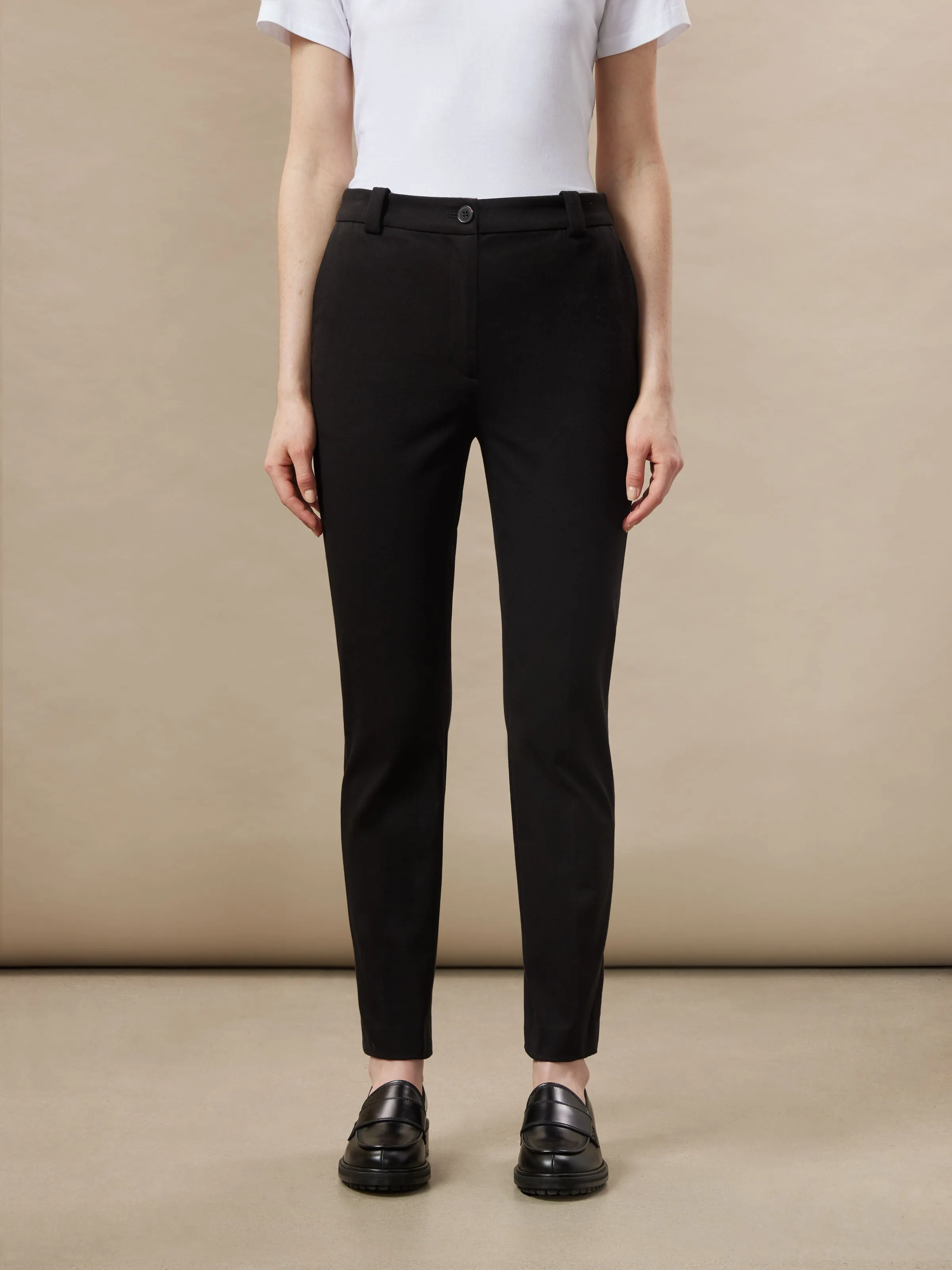 The Eleanor Slim Flex Pant in Black sold by Frank & Oak