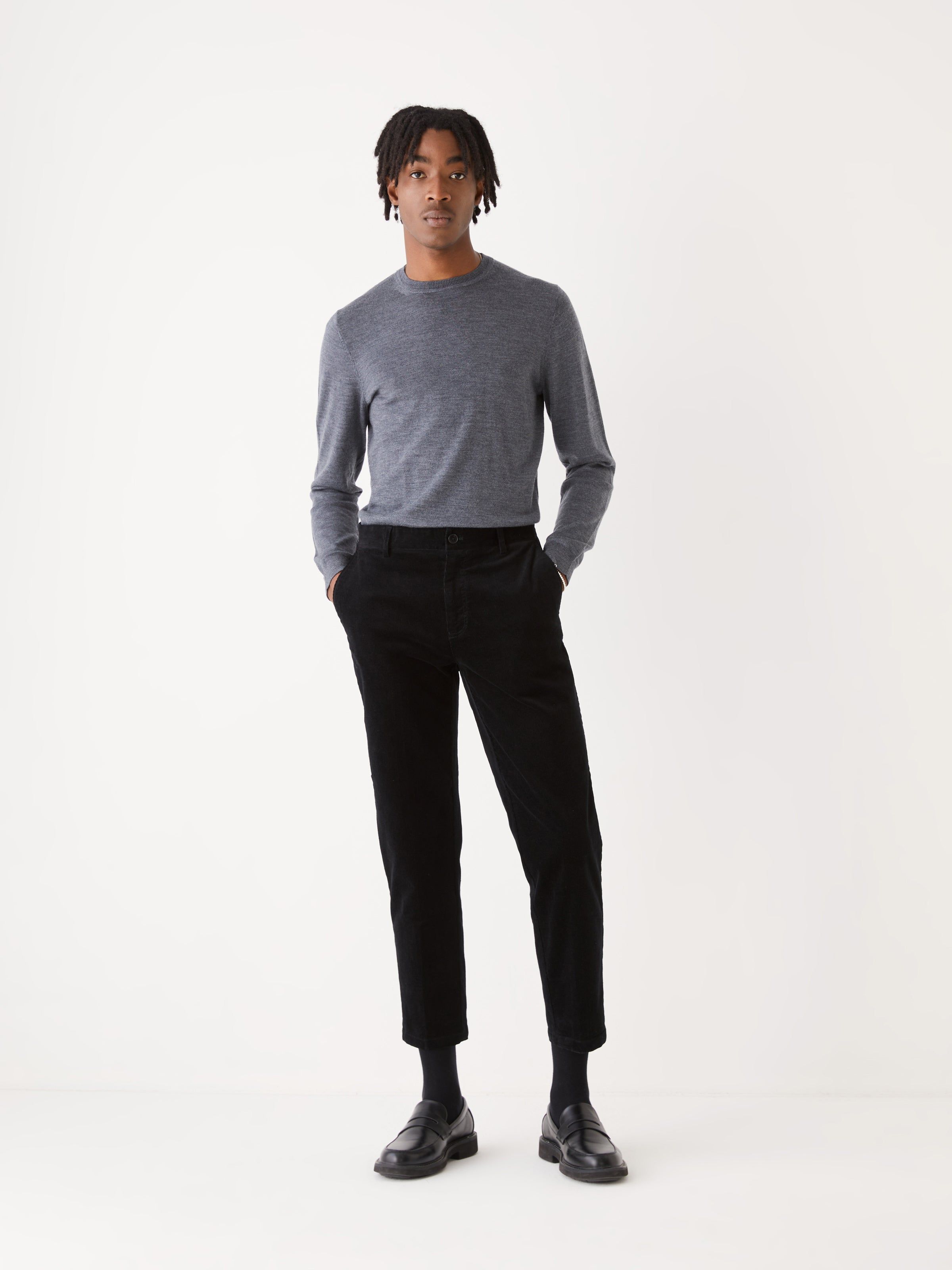 The Cropped Tapered Fit Corduroy Pant in Black sold by Frank & Oak