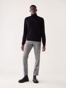 The Merino Wool Turtleneck in Black sold by Frank & Oak