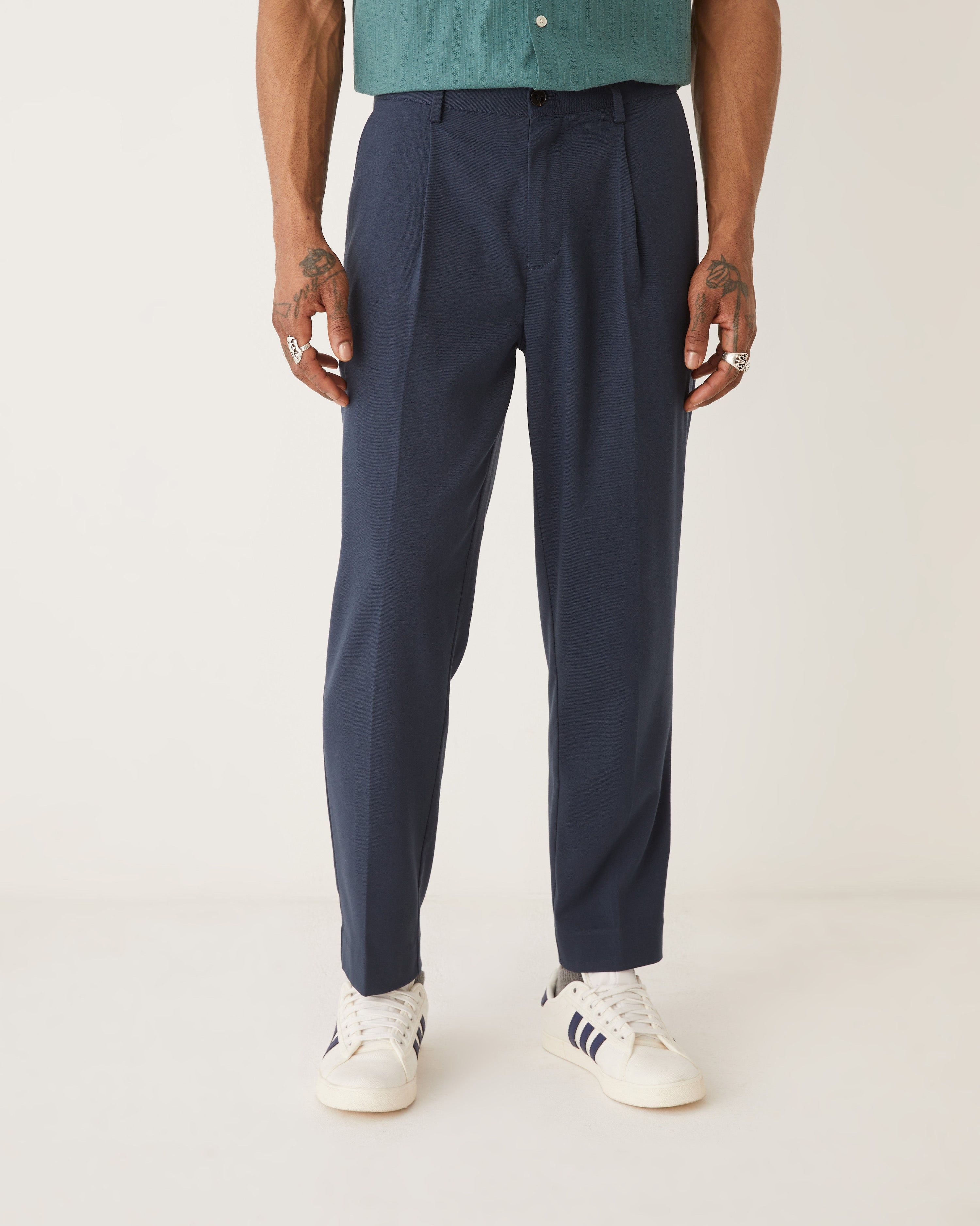 The Pleated Tapered Fit Pant in Dark Navy sold by Frank & Oak