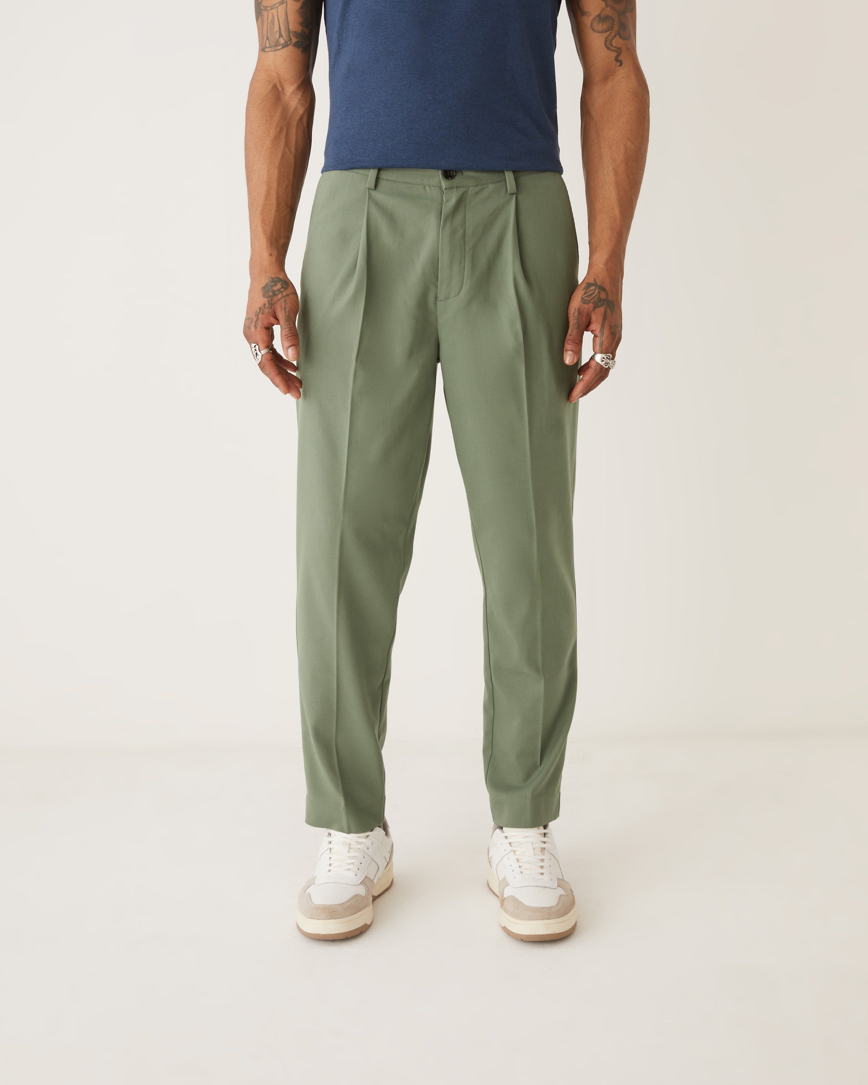 The Pleated Tapered Fit Pant in Green sold by Frank & Oak