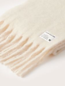 The Fuzzy Scarf in White sold by Frank & Oak