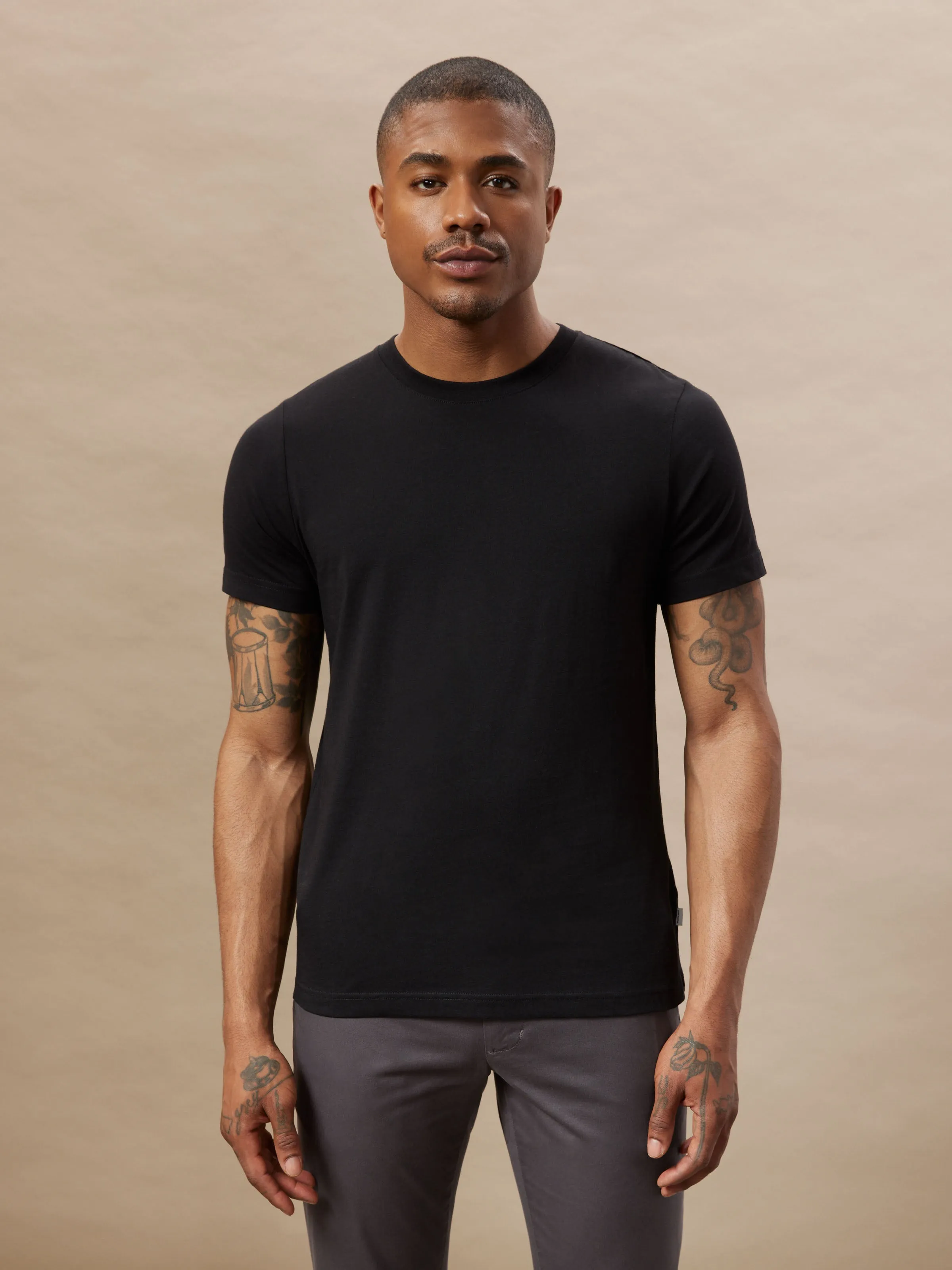 The Slim Fit Essential T-Shirt in Black sold by Frank & Oak