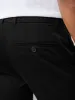 The Colin Tapered Flex Pant in Black sold by Frank & Oak