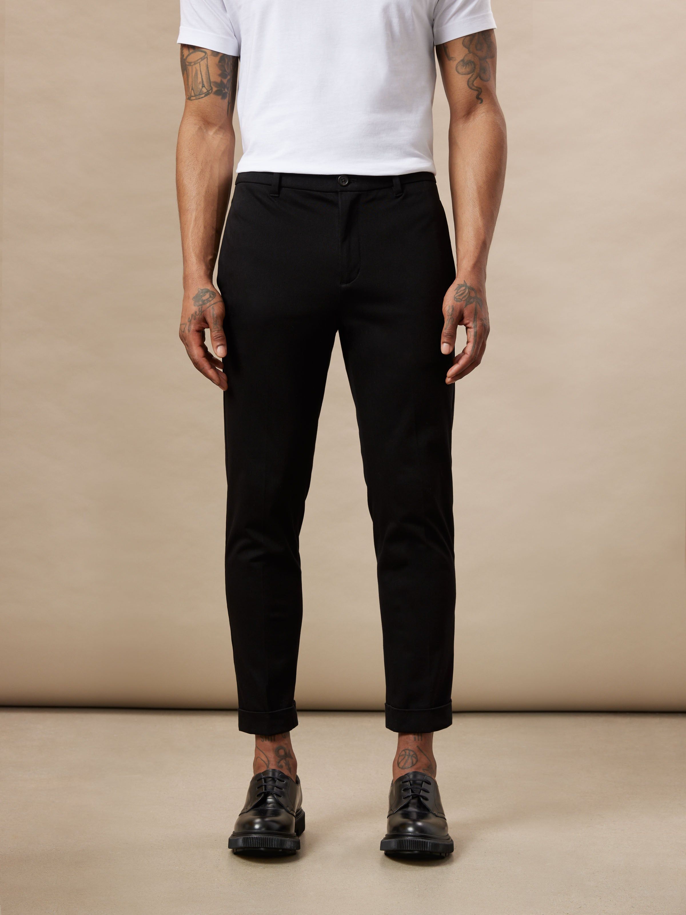 The Colin Tapered Fit Flex Pant in Black sold by Frank & Oak