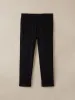 The Colin Tapered Flex Pant in Black sold by Frank & Oak