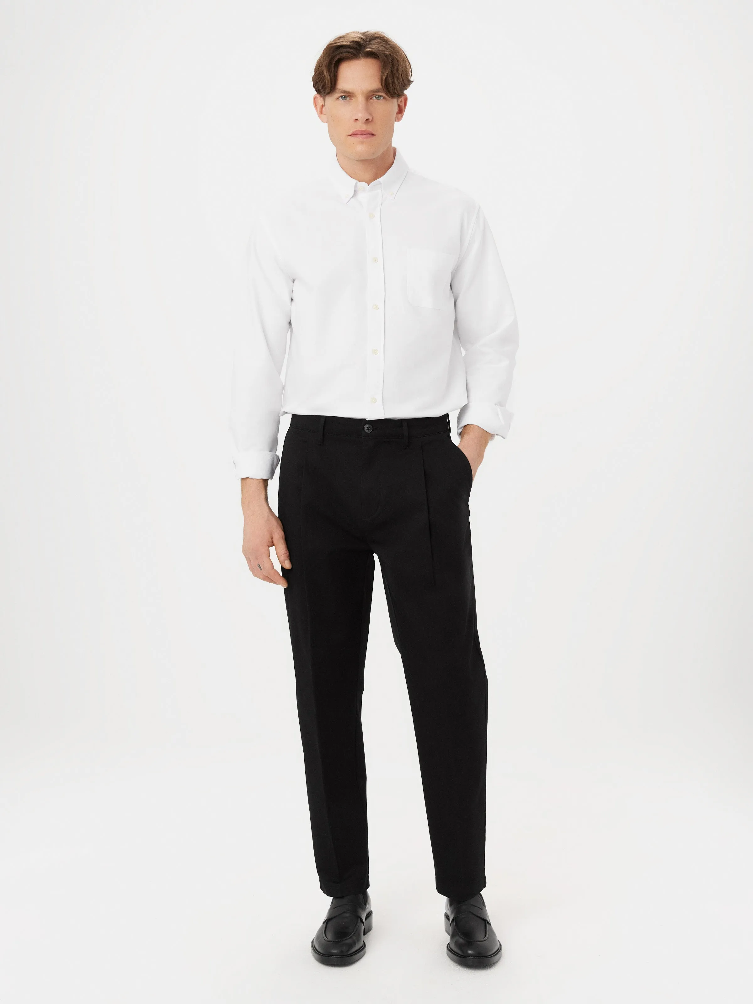 The Jamie Relaxed Tapered Pant in Black sold by Frank & Oak