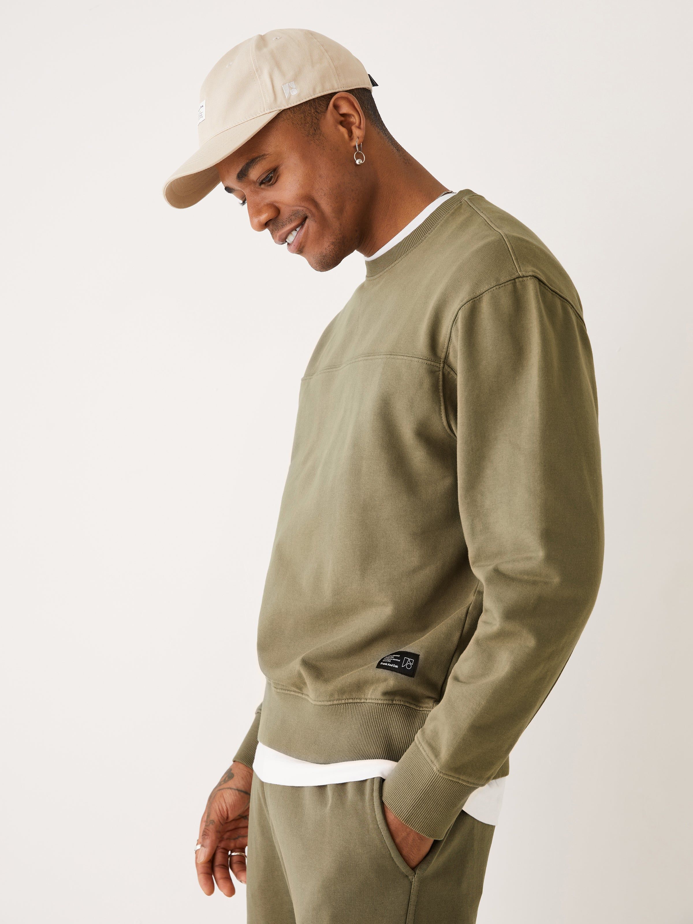 The Washed Crewneck Sweatshirt in Dark Olive sold by Frank & Oak