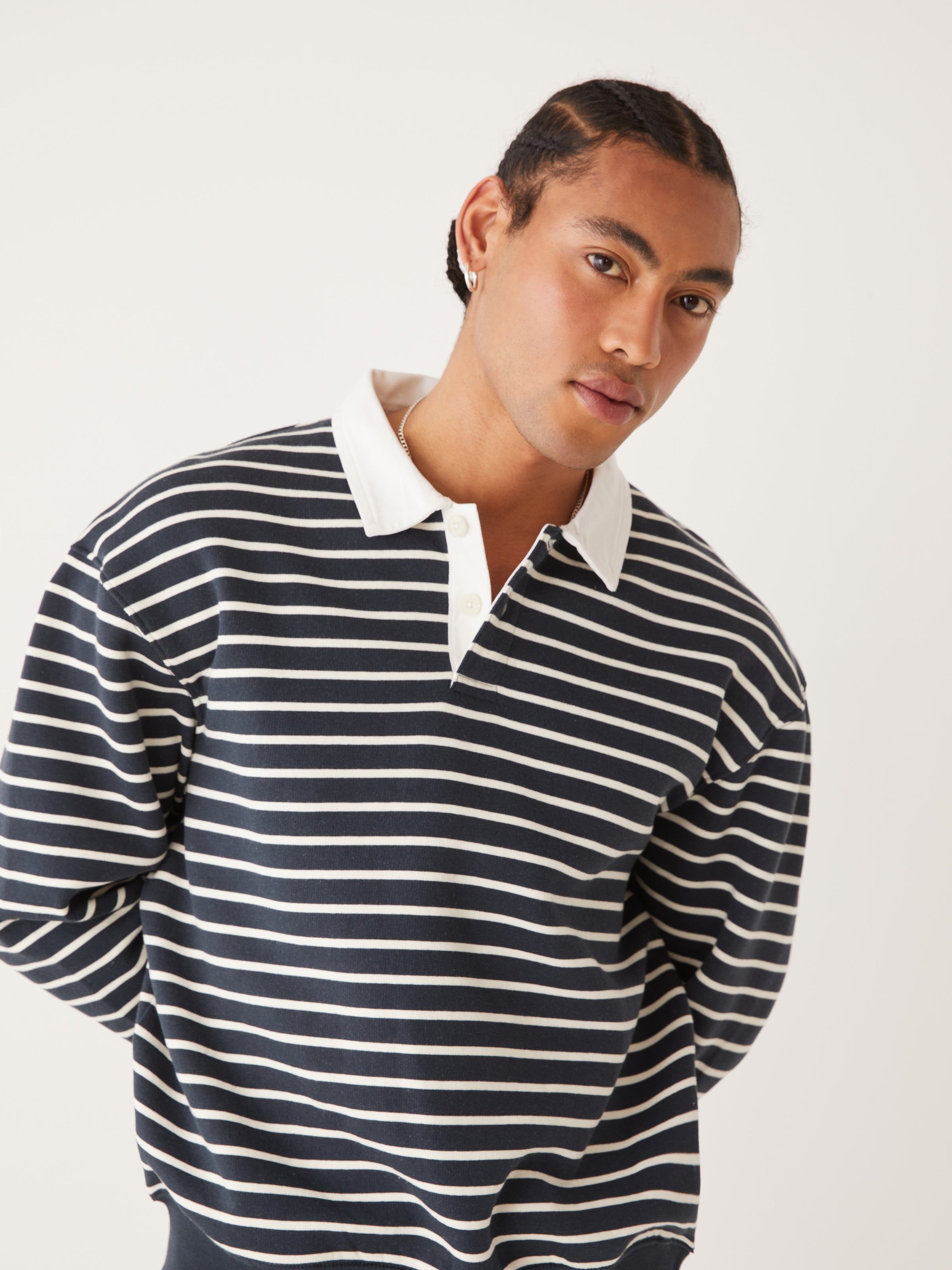 The Fleece Striped Polo Sweater in Dark Navy sold by Frank & Oak