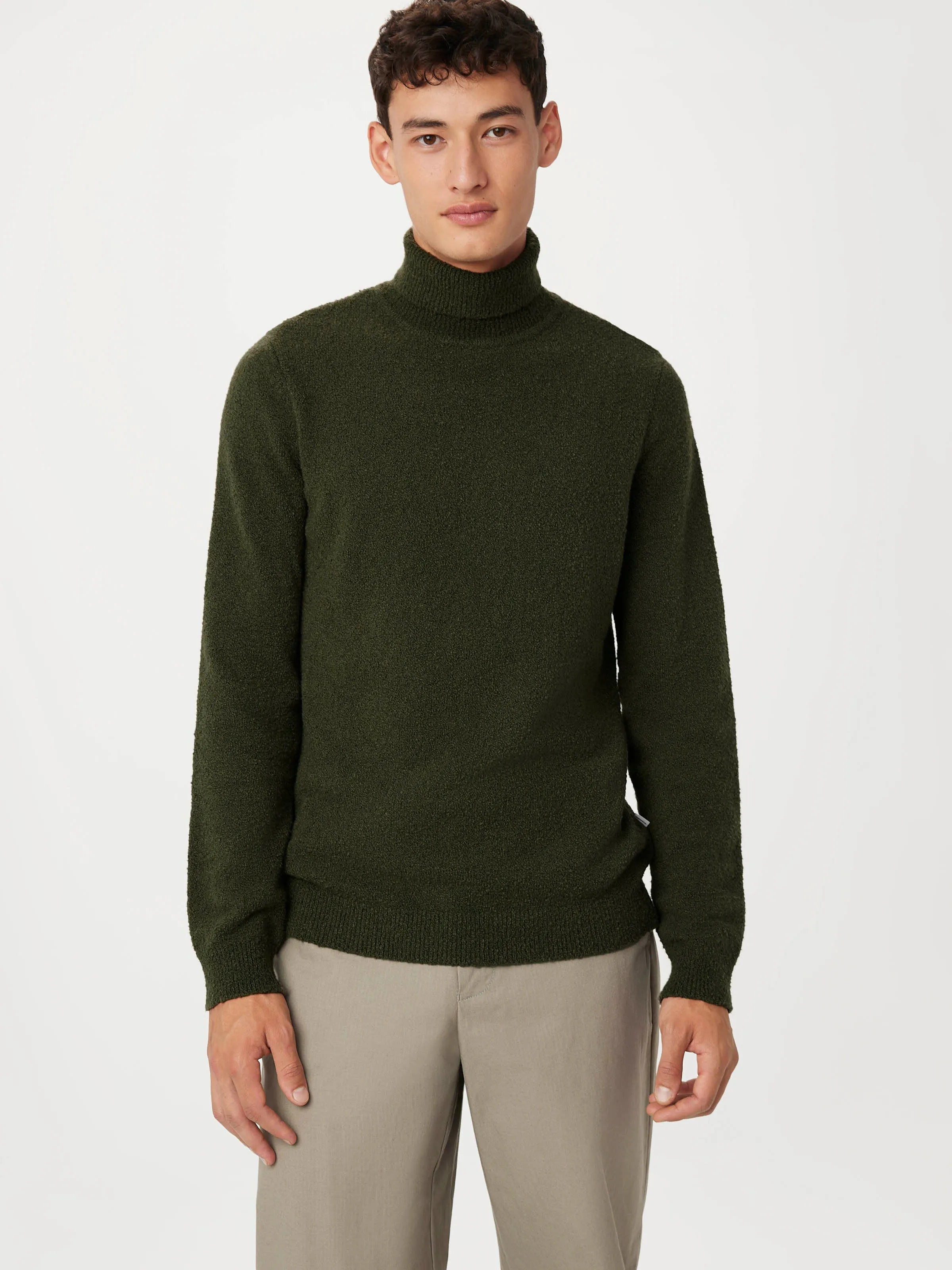 The Seawool® Boucle Turtleneck in Dark Green sold by Frank & Oak