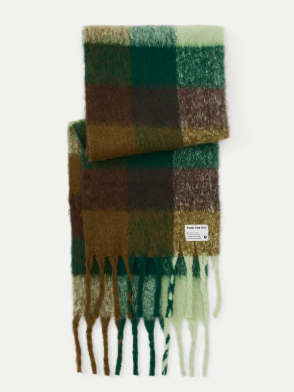 The Check Fuzzy Scarf in Bottle Green sold by Frank & Oak