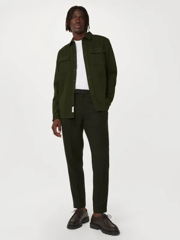 The Colin Tapered Recycled Wool Pant in Dark Green sold by Frank & Oak