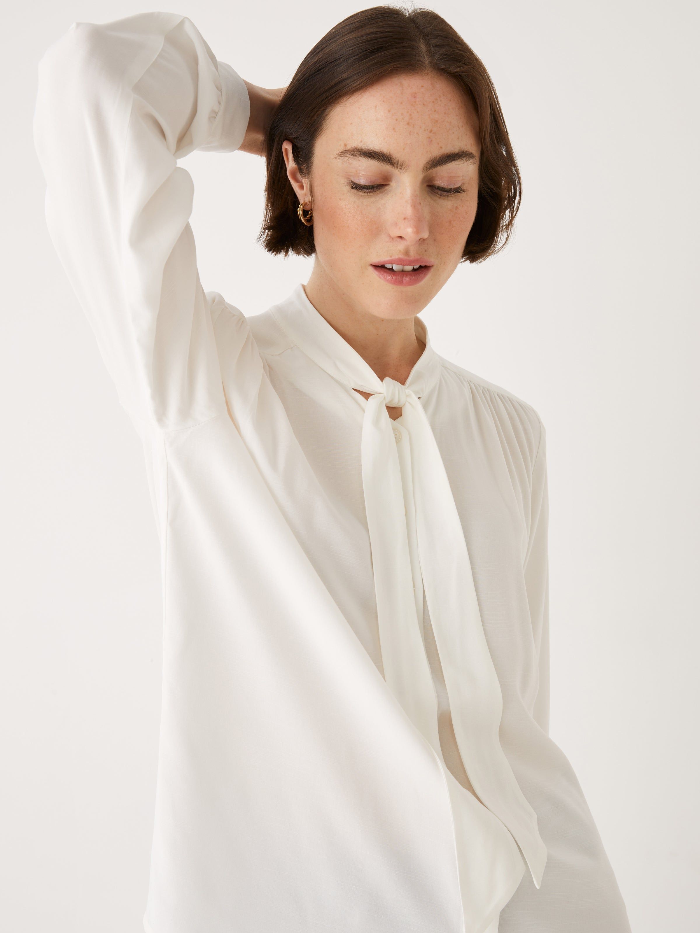 The Tie Neck Blouse in White sold by Frank & Oak