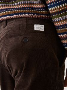 The Cropped Tapered Fit Corduroy Pant in Brown sold by Frank & Oak