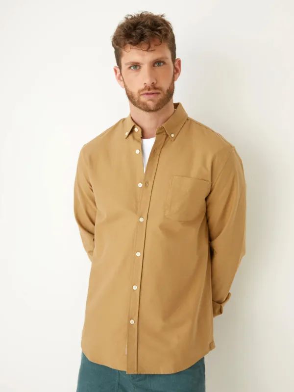 The Jasper Oxford Shirt in Kelp Brown sold by Frank & Oak