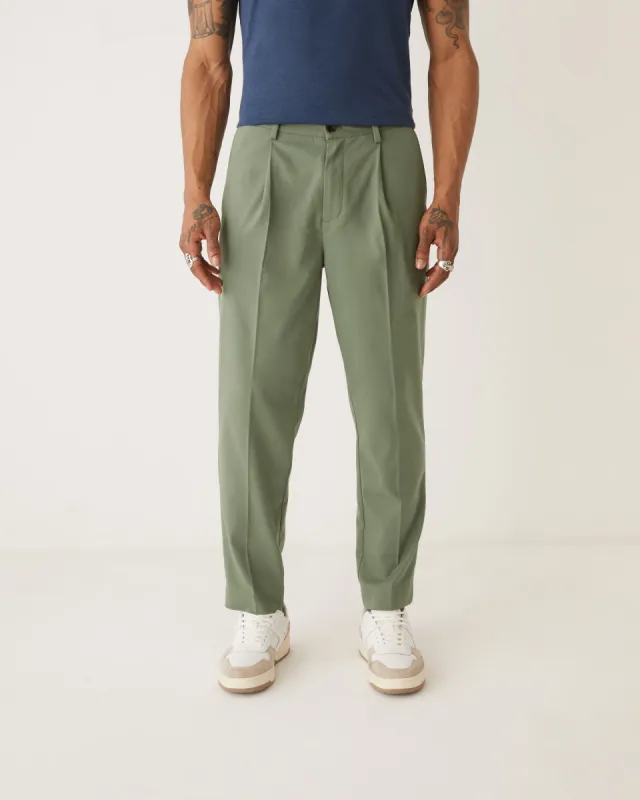 The Pleated Tapered Fit Pant in Green sold by Frank & Oak