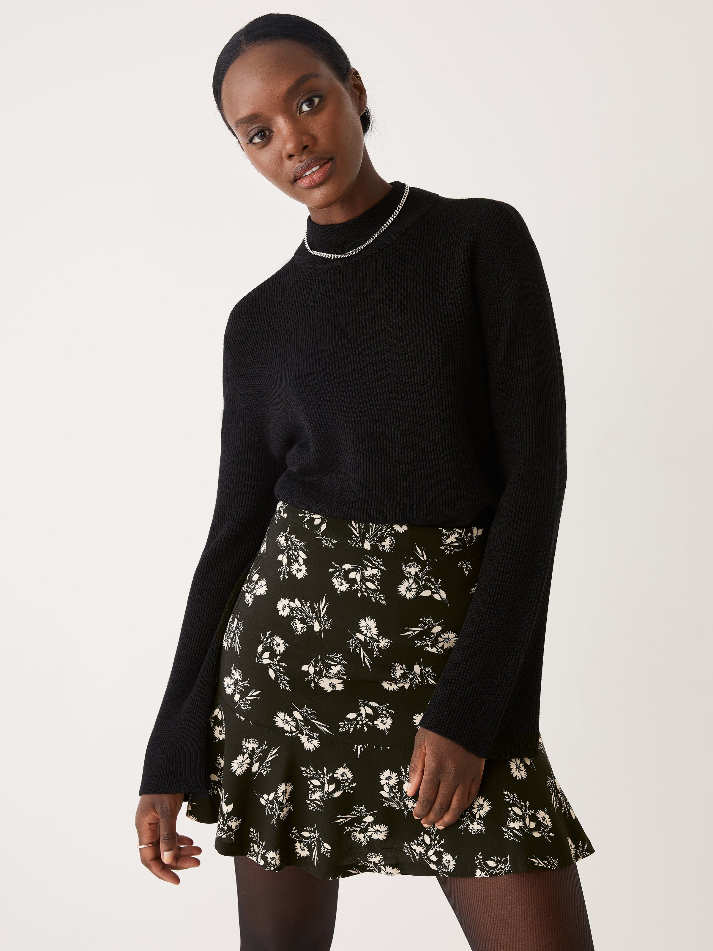 The Merino Wool Mockneck Sweater in Black sold by Frank & Oak