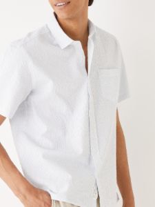 The Short-Sleeved Striped Seersucker Shirt in Blue sold by Frank & Oak