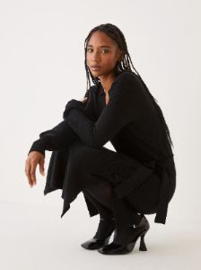 The Merino Wool Sweater Dress in Black sold by Frank & Oak