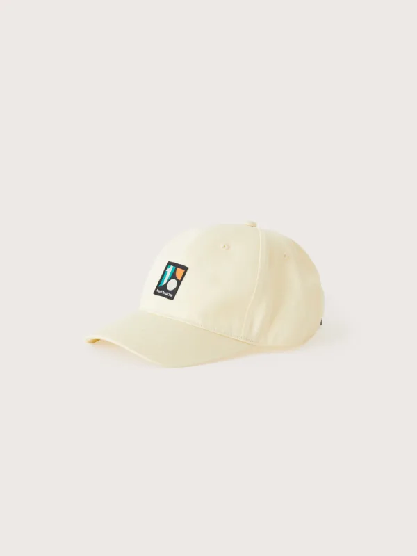 The 10 Year Anniversary Cap in Beige sold by Frank & Oak