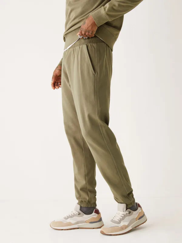 The Washed Jogger in Dark Olive sold by Frank & Oak