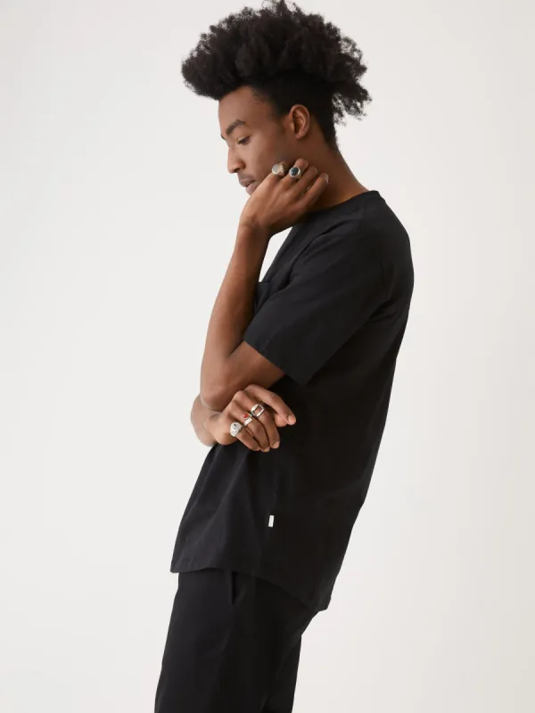 The Relaxed Fit Arc Hem T-Shirt in Black sold by Frank & Oak