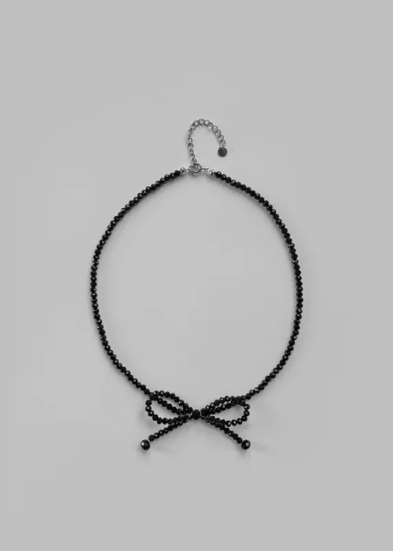 Adelphine Beaded Bow Necklace - Black made by Frankie Shop