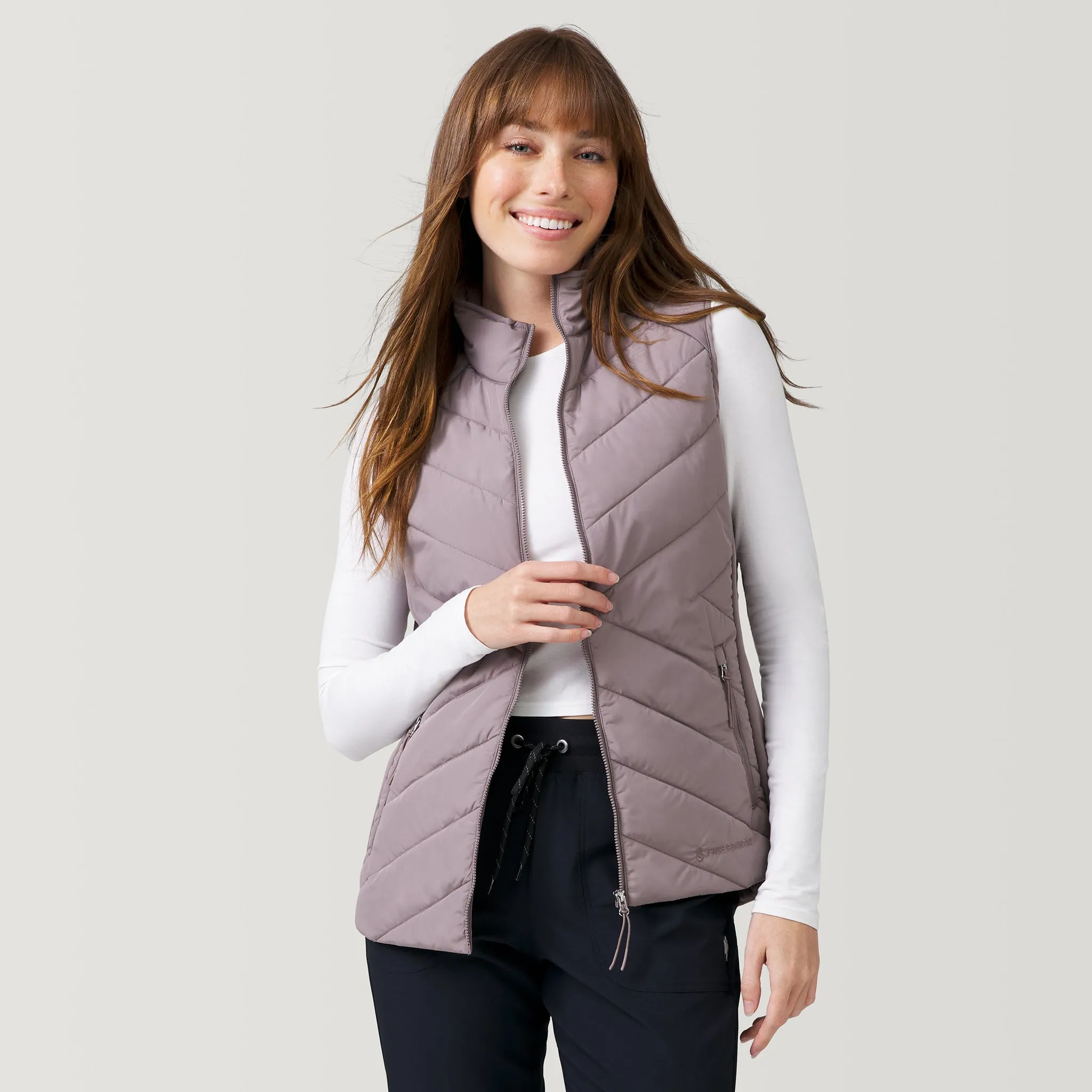 Women's Quilted Hybrid Vest sold by Free Country