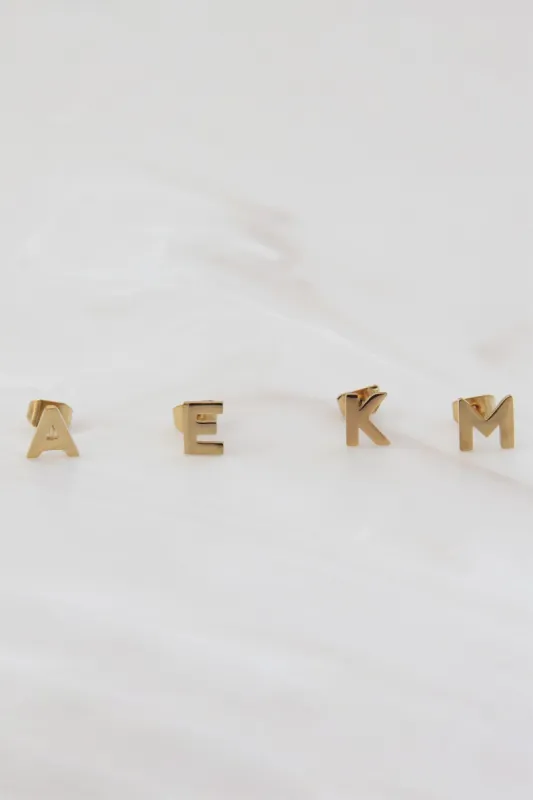 Gold Initial Studs sold by French Cuff