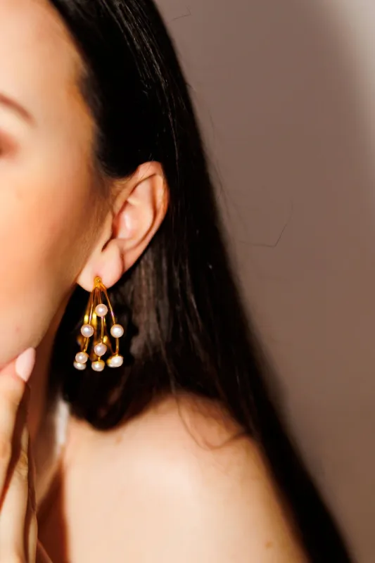 The Petite Marguerite Hoop sold by French Cuff