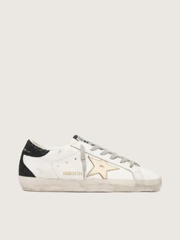 Women's Super-Star with gold star and black glitter heel tab made by Golden Goose