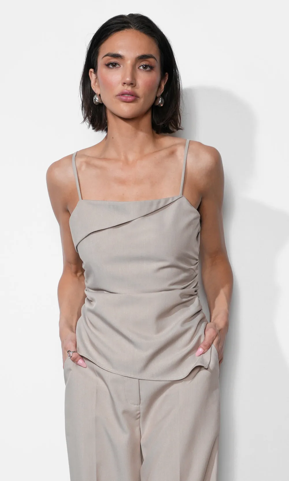 Acacia Fold Over Neck Cinched Waist Asymmetric Top sold by Greylin